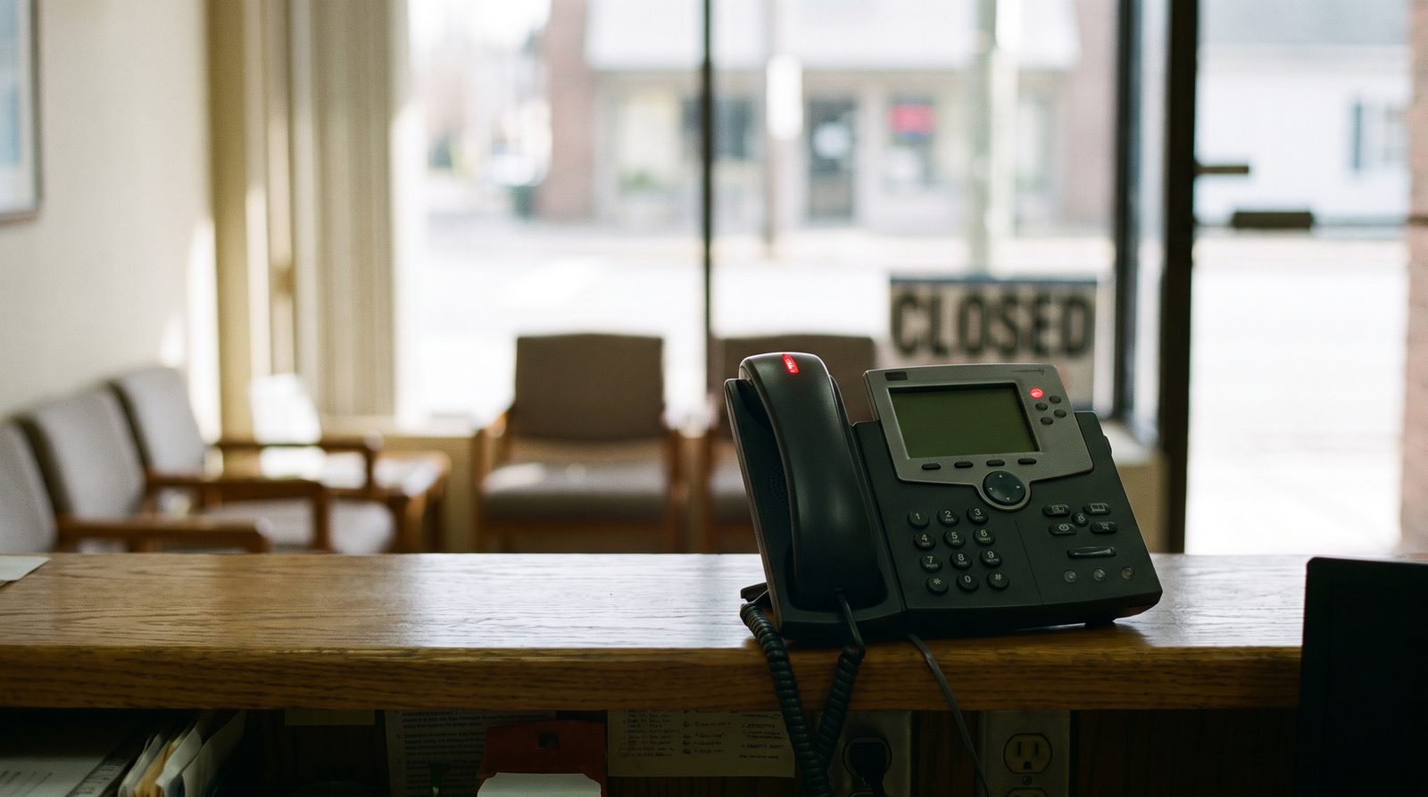 A ringing phone on an unattended clinic front desk